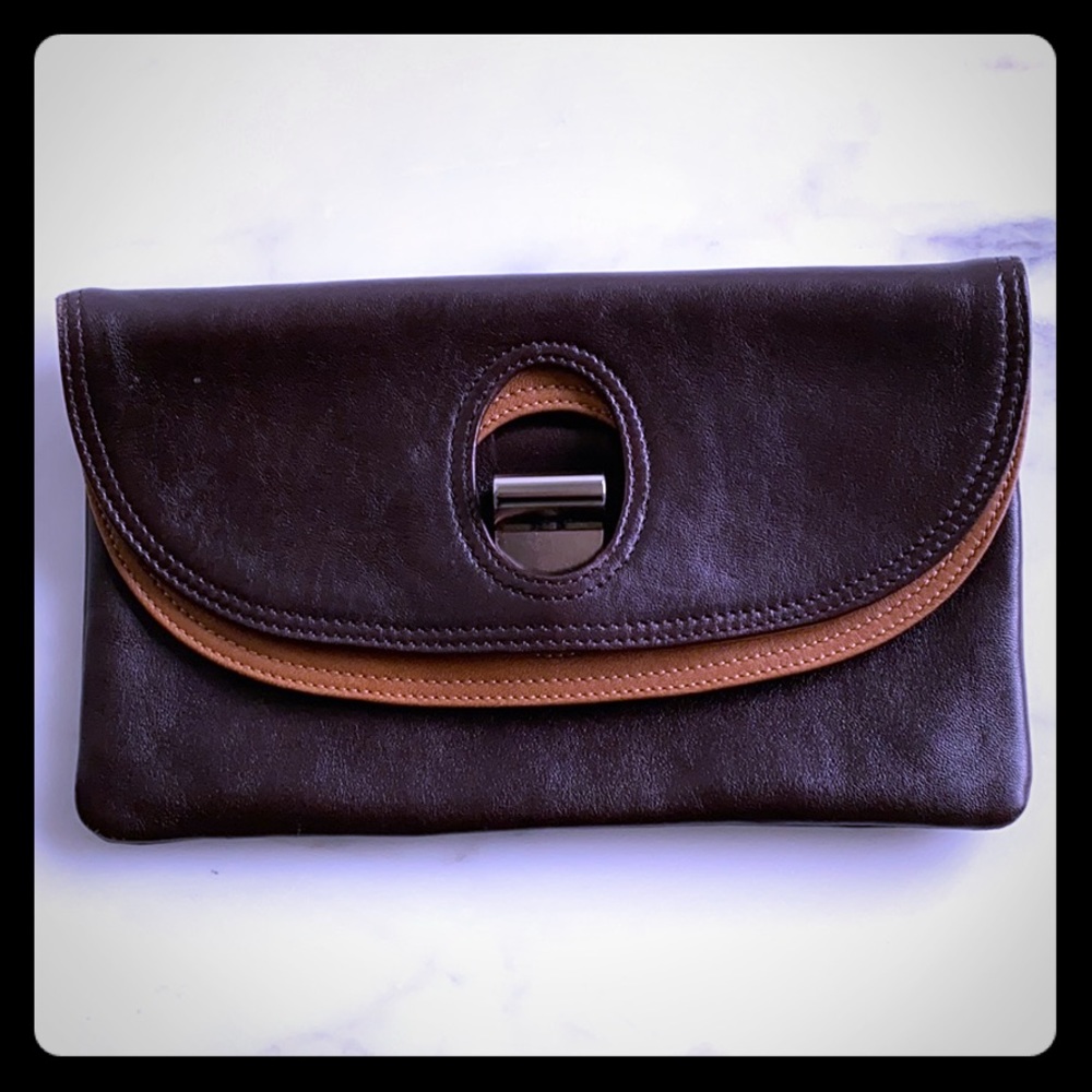 Brown and Tan Clutch with metal buckle closure.